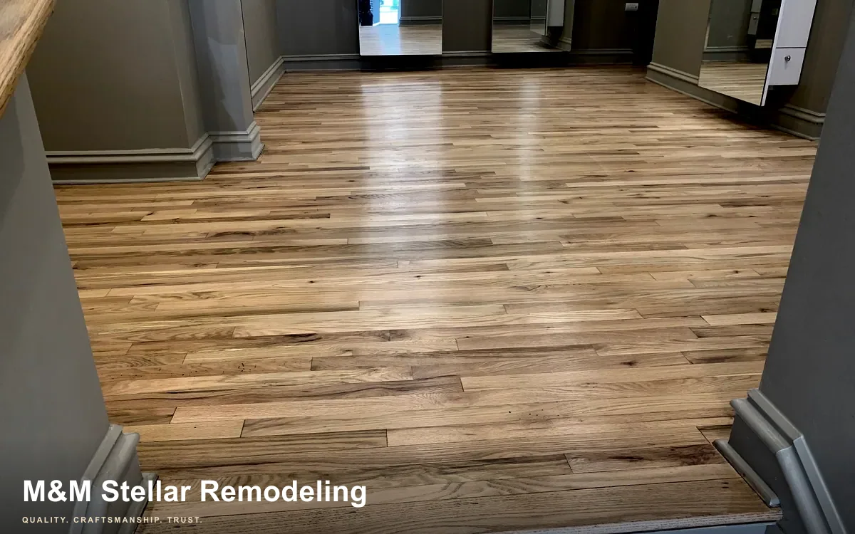 M&M Stellar hardwood flooring with a clean refinished surface.